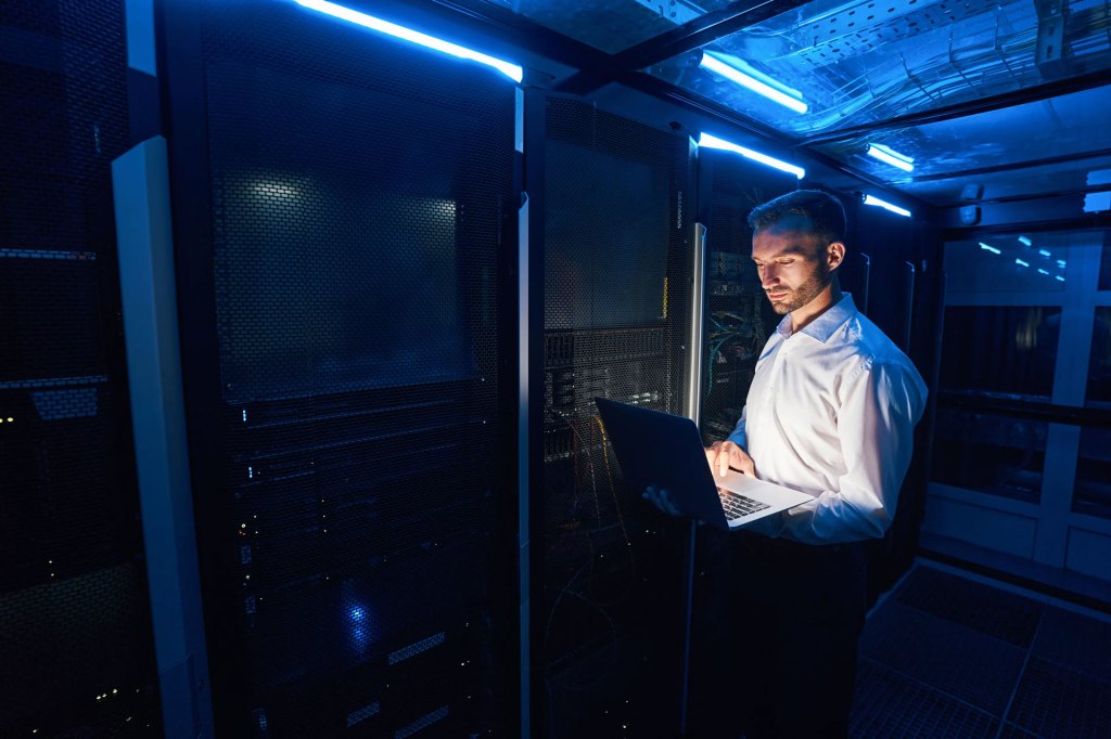 Engineer checking equipment in a server room