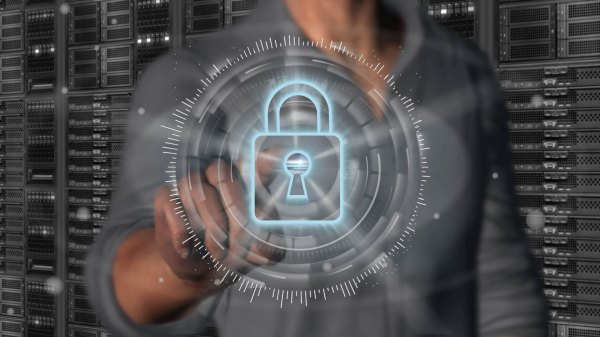 Man touching a touchscreen with a padlock icon