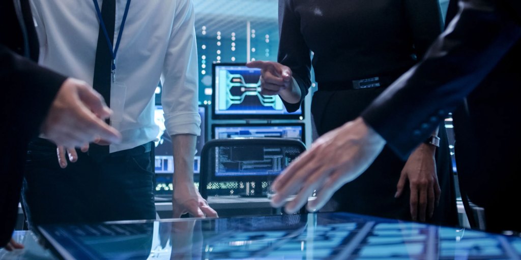 Business team using an interactive digital display during a meeting